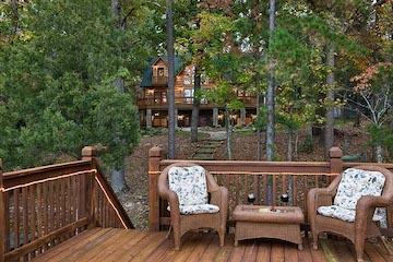 Photo of natural wood deck and wood stairwell and handrails